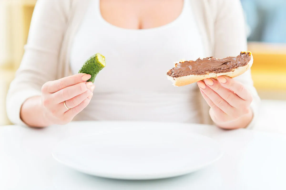 Woman experiencing PMS cravings