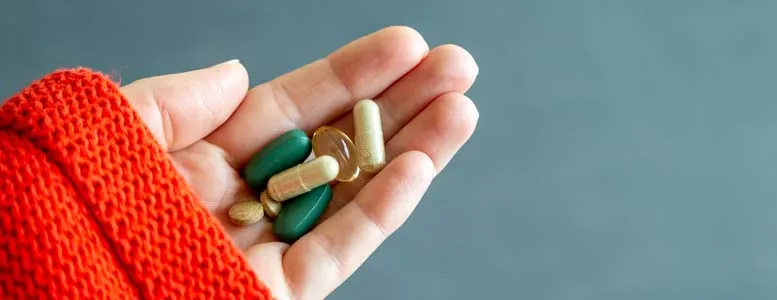 supplements in hand